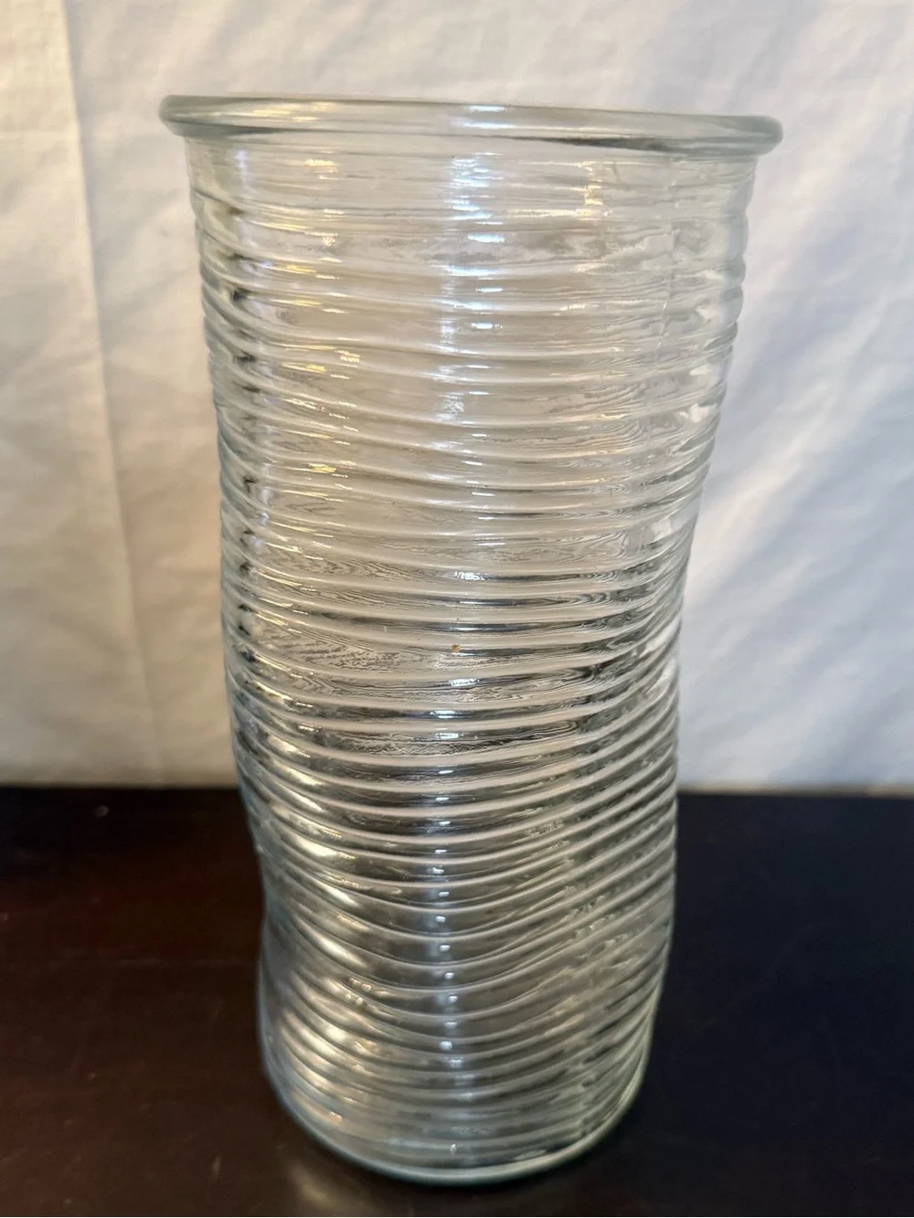 Ribbed glass vase, wavy, pinched shape. Mid-Century Modern design. 9.75”